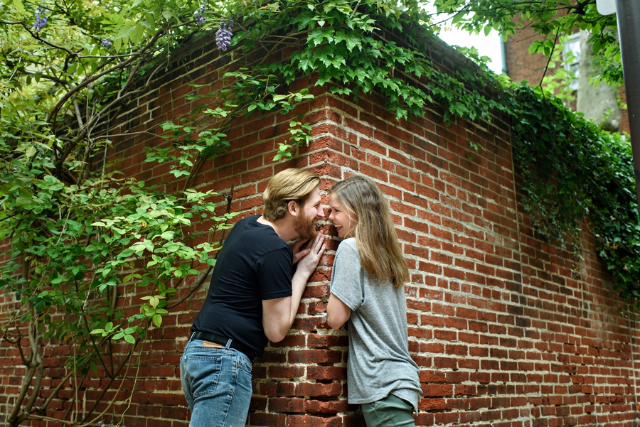 A couple being silly in center city during their engagement session.